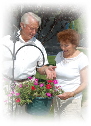 Elderly couple looking at flowers